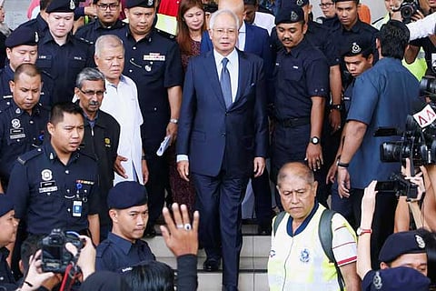 Malaysia's former Prime Minister Najib Razak leaves a court in Kuala Lumpur, Malaysia