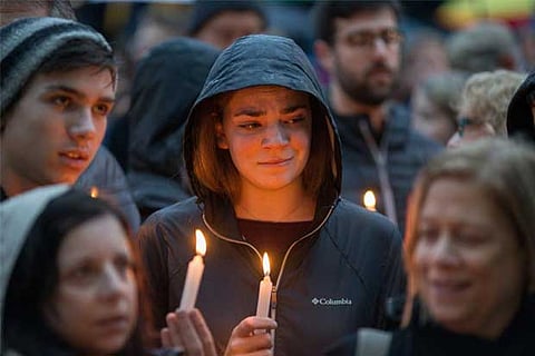People mourn the loss of life as they hold a vigil for the victims of Pittsburgh synagogue shooting