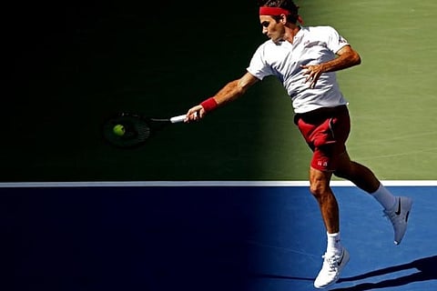 Roger Federer of Switzerland hits a forehand against Nick Kyrgios in the third round of the US Open