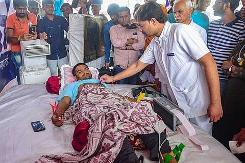 A doctor checks the health of Patidar Anamat Andolan Samiti (PAAS) leader Hardik Patel