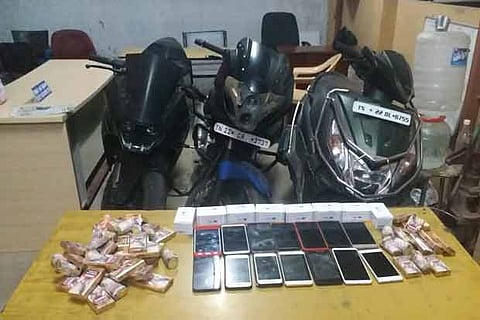 The seized two-wheelers and mobile phones