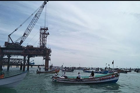 Fishermen lay siege to the coal jetty construction site near the shore near Kallamozhi