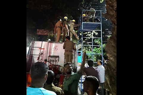 Police personnel bring down the body on Tuesday