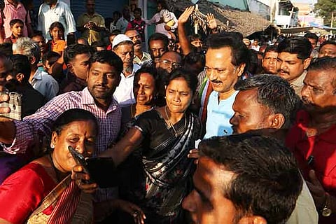 Locals take a selfie with DMK president MK Stalin during his morning walk in Krishnagiri