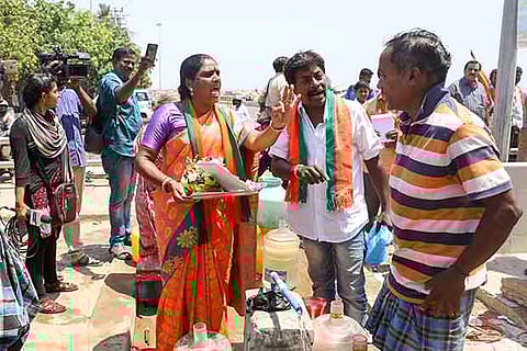 BJP workers campaigning for AIADMK candidate  Jayavardhan at Nochikuppam on Marina on Thursday
