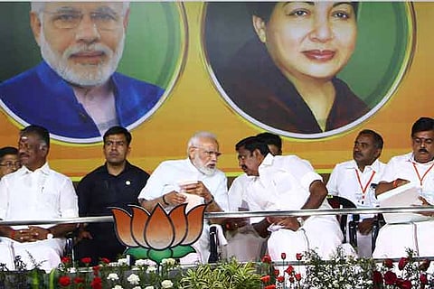 Prime Minister Narendra Modi has a word with Chief Minister K Palaniswami in Coimbatore on Tuesday