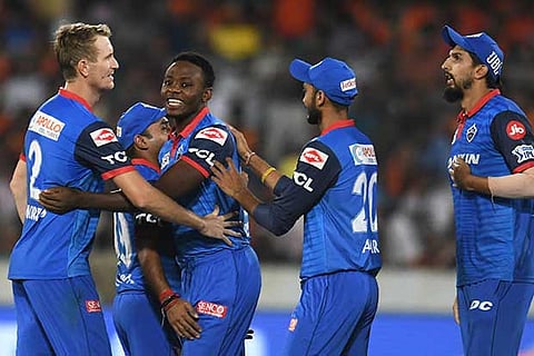 Delhi Capitals pacer Kagiso Rabada celebrates one of his four wickets with his team-mates