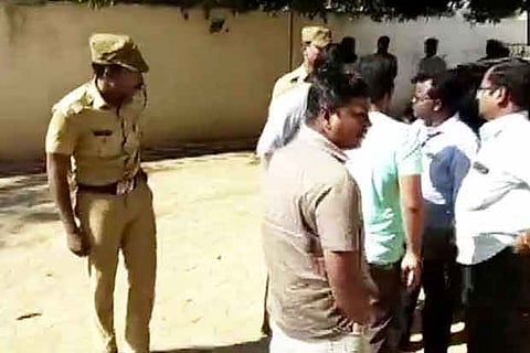 Income Tax officials outside the residence of NR Congress president N Rangasamy, in Puducherry on Wednesday