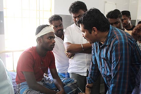 Kathir interacts with an injured victim at Jayamkondam government hospital on Sunday