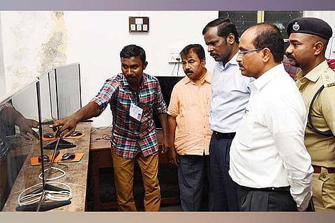 Additional CEO M Balaji inspecting the footage at the strong room in Madurai on Monday