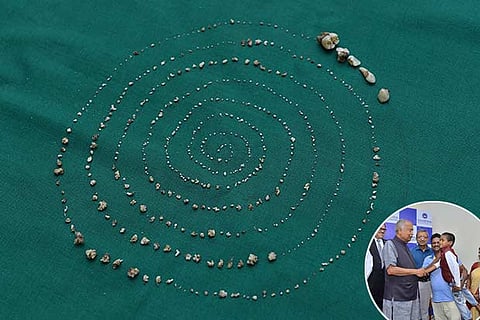 It took a five-hour surgery to extract all the extra teeth; (inset) Ravindran meets his doctors