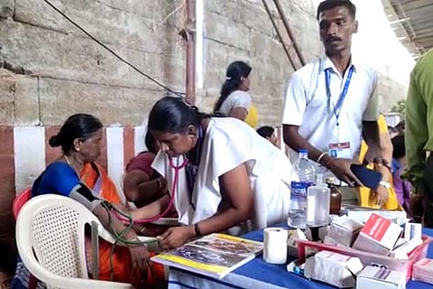 A woman who suffered electric shock being checked at the medical desk at the temple on Wednesday