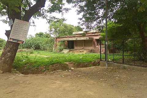 The building located adjacent to Arignar Anna Park on Ayapakkam Housing Board