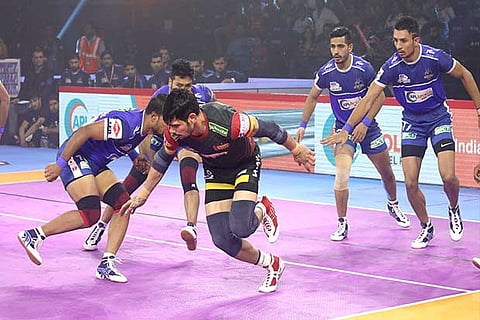 Rohit Kumar of Bengaluru Bulls goes for a raid against Haryana Steelers