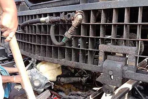 The two-wheeler which was crushed under the train