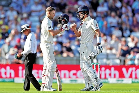 England captain Joe Root (left) and Joe Denly during their partnership