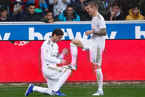 Real skipper Ramos (left) celebrates his goal with Kroos