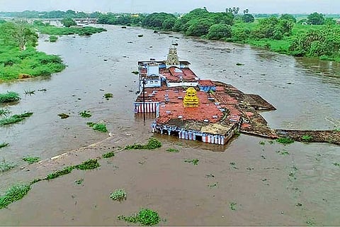 An aerial view of the Kurukkuthurai Murugan temple in the Tamirabarani at Tirunelveli on Saturday