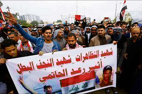Iraqis mourn protest dead ahead of parliament session