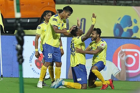 Kerala players celebrate scoring against FC Goa