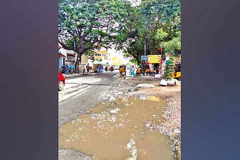 Sewage overflowing from manholes floods the 550-foot-long road
