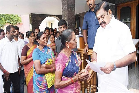 CM receiving petitions from the residents at the camp office in Salem on Friday