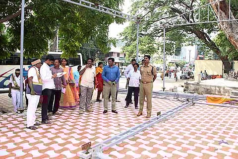 Collector Kandasamy and SP Sibi Chakravarthi inspect the girivalam path in Tiruvannamalai, on Friday