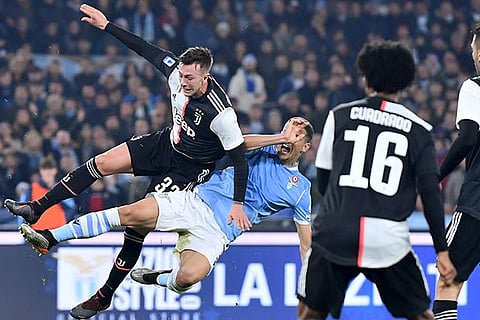 Juventus and Lazio players involved in a duel