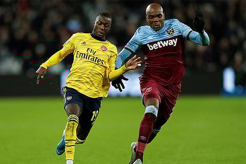 Arsenal forward Nicolas Pepe (left) scored a goal and set up another