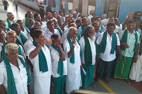 Farmers, led by P Ayyakannu, stage a protest at Tiruchy Junction railway station on Thursday