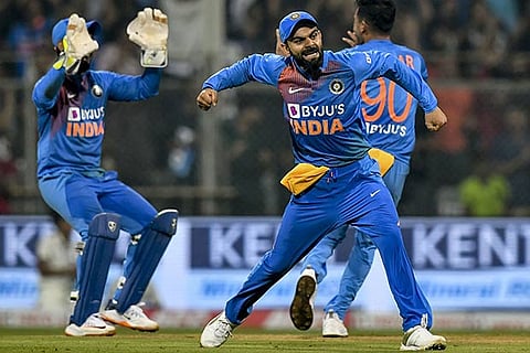 India captain Virat Kohli celebrates the fall of a West Indies wicket in the T20 International in Mumbai