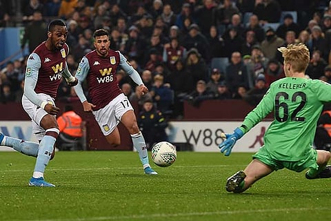 Aston Villa?s Jonathan Kodjia (left) scores his team?s third goal against Liverpool