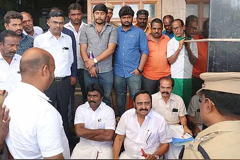 DMK MP SR Parthiban and other functionaries during a sit-in protest at Salem Collector?s office on Friday