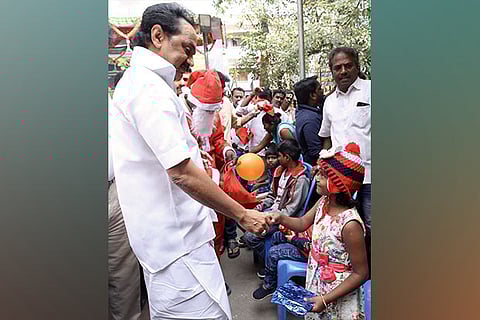 Stalin greets a child at a Christmas event in Chennai, on Friday