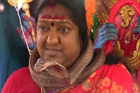 Godwoman held over snake pooja