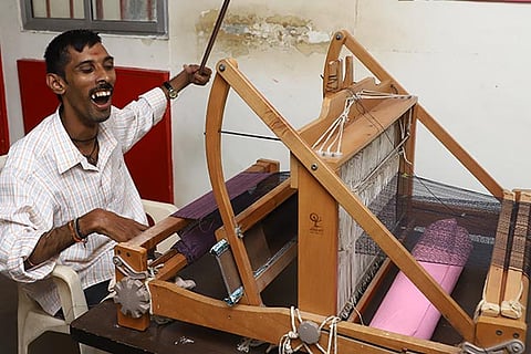 A differently-abled person weaving at Vidya Sagar?s Mela held in Kotturpuram on Saturday