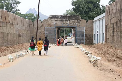 Trenches dug up on either side of Vellore fort entrance for laying a new footpath