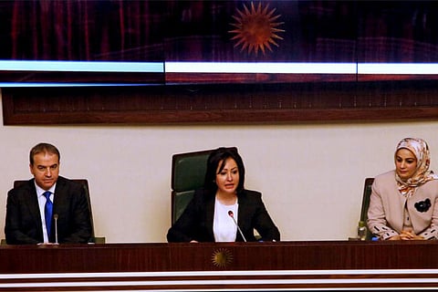 Vala Fareed, interim Speaker of Parliament (center)