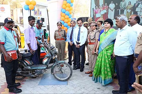 A prisoner filling fuel in a two-wheeler during the inauguration of an IndianOil outlet in Vellore on Friday