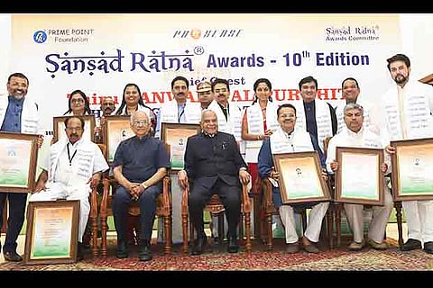 Governor Banwarilal Purohit with the winners during the function held at the  Durbar Hall in Raj Bhavan