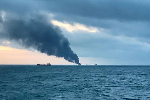 Smoke rises from a fire at a ship in the Kerch Strait near Crimea