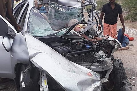 The mangled remains of the car, which rammed into a stationary truck near Ettayapuram on Thursday