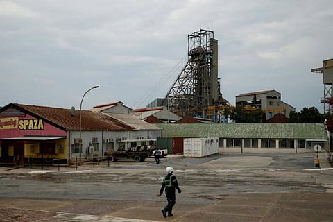 A mine worker walks towards a shaft at Cullinan mine, near Pretoria, South Africa. Source: Reuters