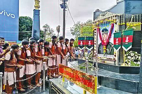 Students paying tribute to the portrait of Major Saravanan in view of 20th  anniversary of victory in Kargil