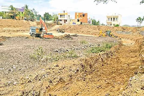 Renovation work under way at rebuilding damaged portions of the bund at the village near Mappedu
