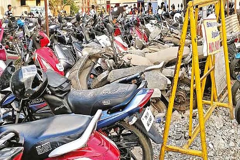 Several vehicles including the unclaimed ones at a parking lot  in Tambaram railway station  Antique