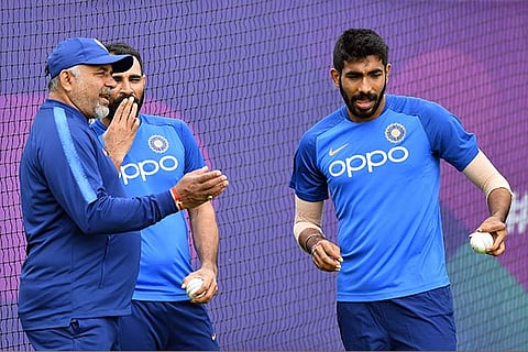 Team India bowling coach Bharat Arun with Mohammed Shami and Jasprit Bumrah