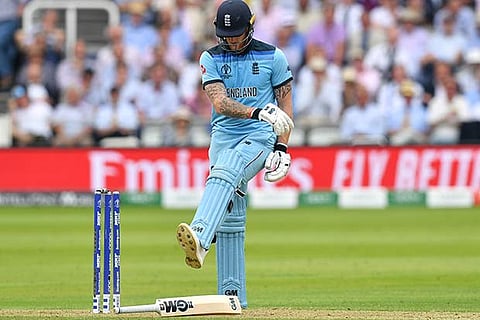 Ben Stokes kicks his bat after getting bowled off Mitchell Starc