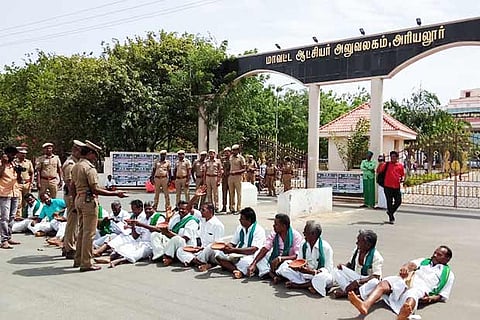 Farmers staging the protest in Ariyalur on Thursday