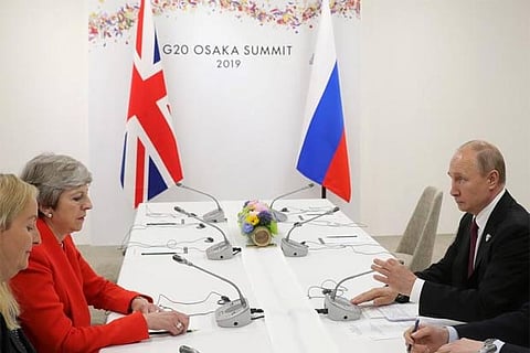 May tells Putin end 'destabilising' acts against UK, allies